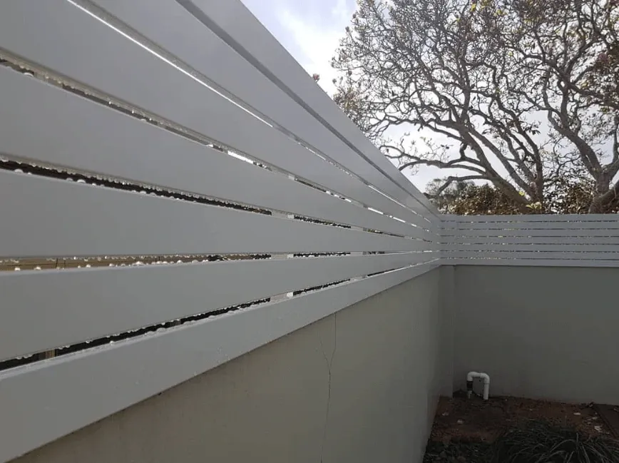 Custom white aluminium slat fencing installed by The Fence Lab